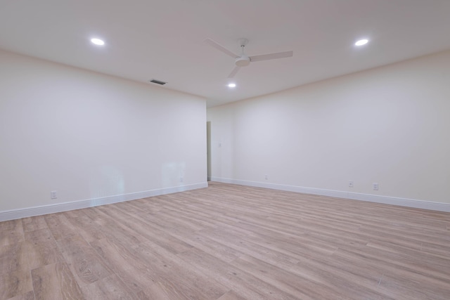 unfurnished room featuring ceiling fan and light hardwood / wood-style flooring