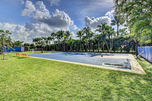 view of basketball court with a lawn