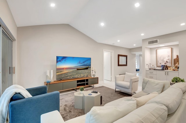 living room with vaulted ceiling