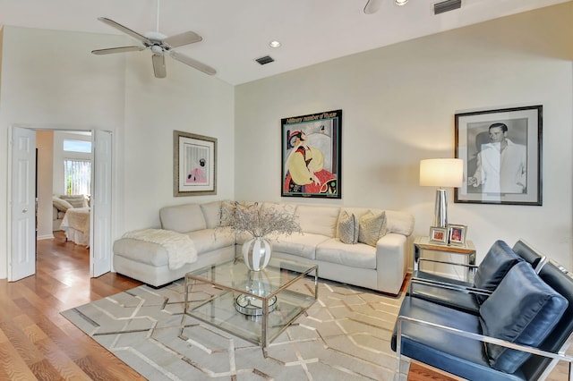 living room featuring ceiling fan and wood-type flooring