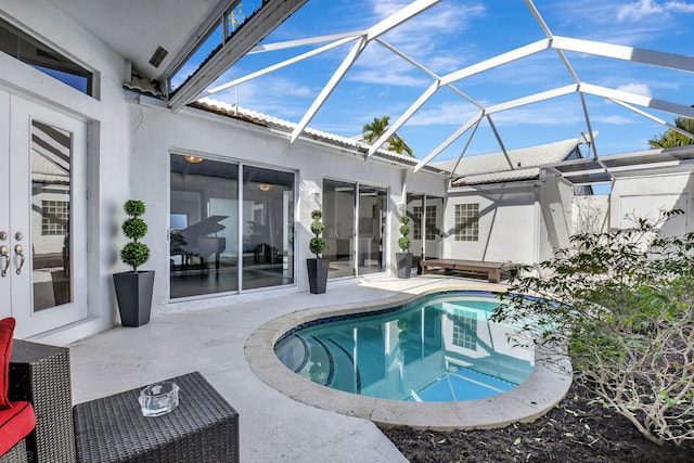 view of pool with a lanai and a patio area