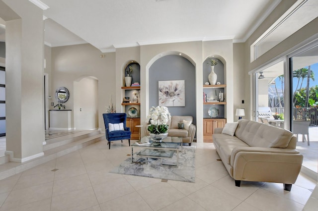 living room featuring built in features, ornamental molding, and light tile patterned floors