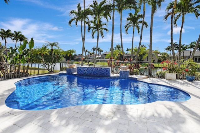 view of swimming pool with pool water feature