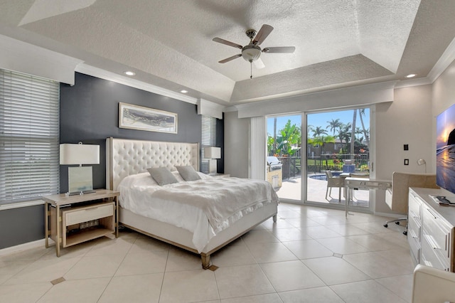 tiled bedroom featuring access to outside, ceiling fan, a tray ceiling, and crown molding