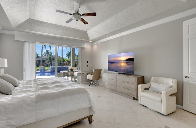 tiled bedroom featuring crown molding, ceiling fan, a tray ceiling, a textured ceiling, and access to outside