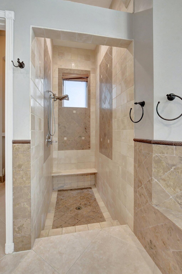 bathroom with a tile shower