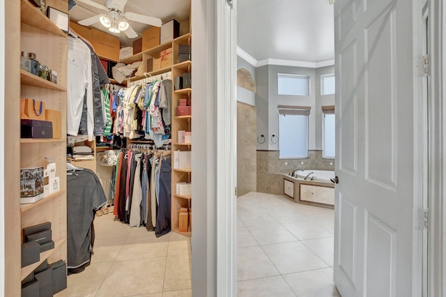 spacious closet featuring ceiling fan and light tile patterned floors