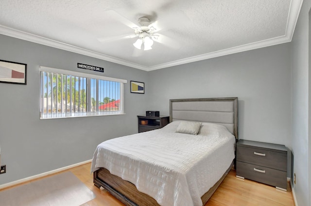 bedroom featuring a textured ceiling, ceiling fan, ornamental molding, and light hardwood / wood-style flooring