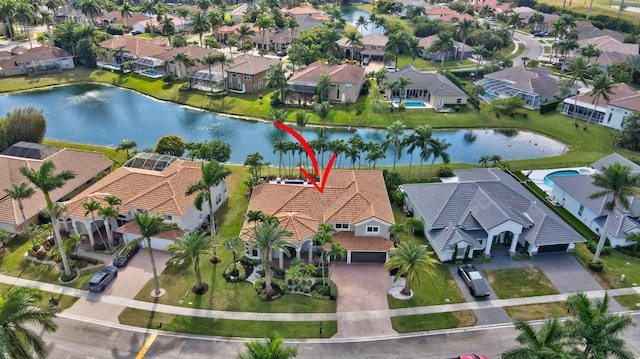 birds eye view of property featuring a water view