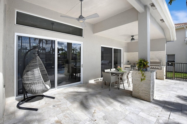 view of patio / terrace featuring an outdoor kitchen and ceiling fan