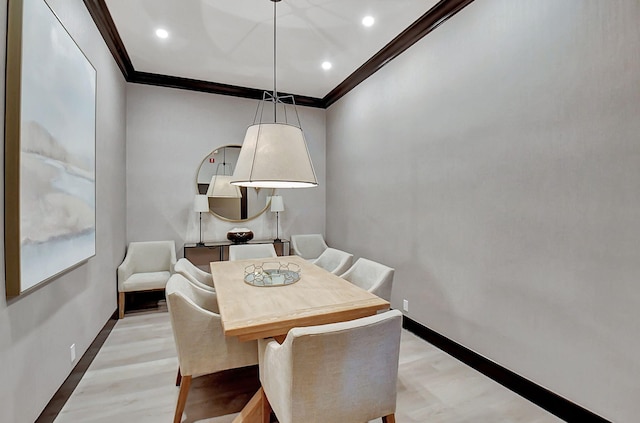 dining area with crown molding