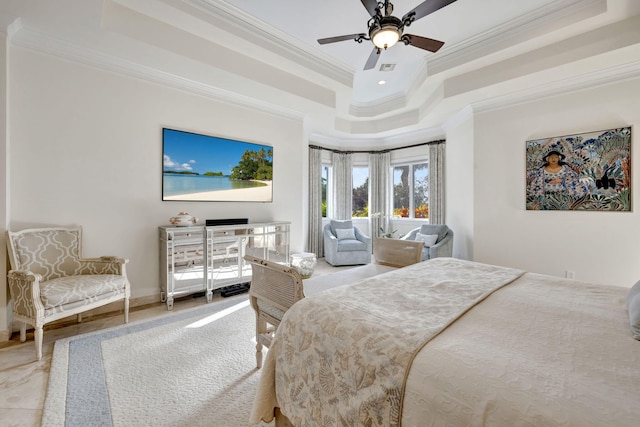 bedroom featuring ornamental molding, ceiling fan, and a tray ceiling