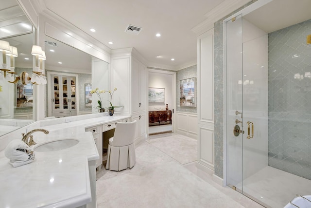 bathroom featuring an enclosed shower, crown molding, and vanity