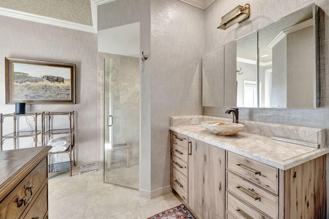 bathroom featuring crown molding, vanity, and a shower with shower door