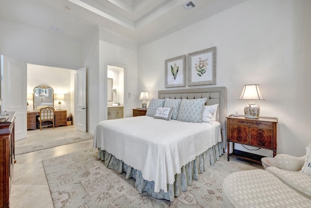 bedroom featuring a high ceiling, ensuite bathroom, and light tile patterned floors