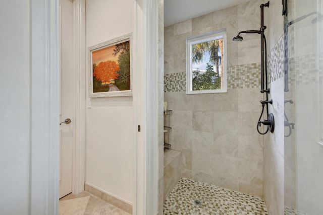 bathroom with tiled shower