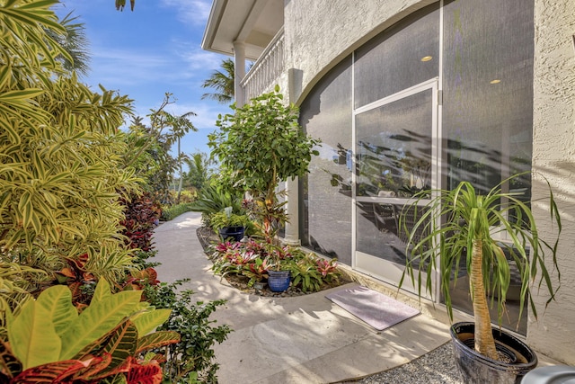 view of patio / terrace featuring a sunroom