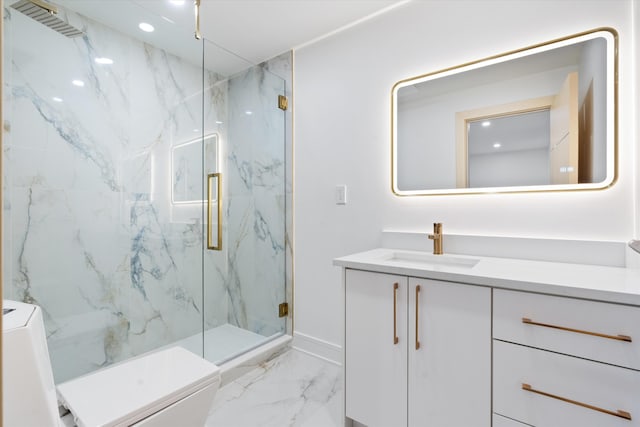 bathroom featuring vanity, toilet, and a shower with door