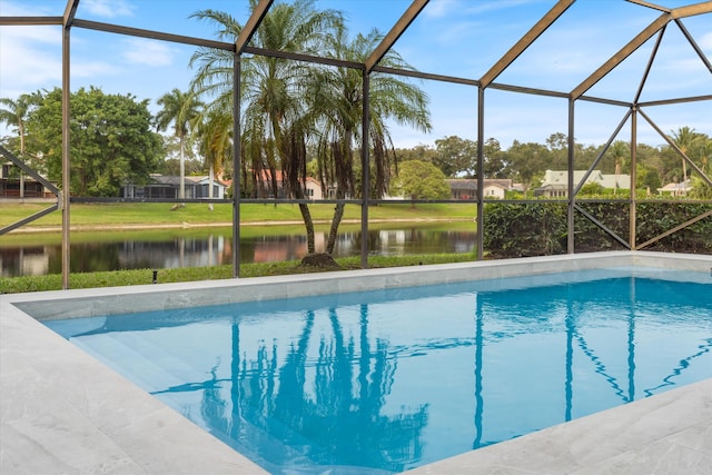 view of pool featuring a water view and glass enclosure