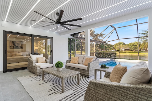 view of patio featuring an outdoor hangout area, a water view, glass enclosure, and ceiling fan