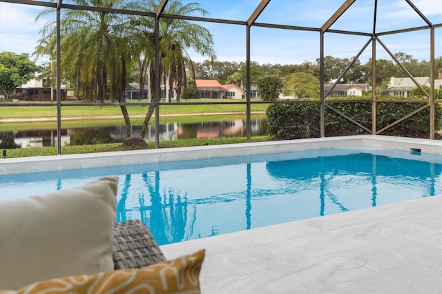 view of swimming pool featuring a water view and glass enclosure