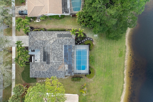 birds eye view of property with a water view