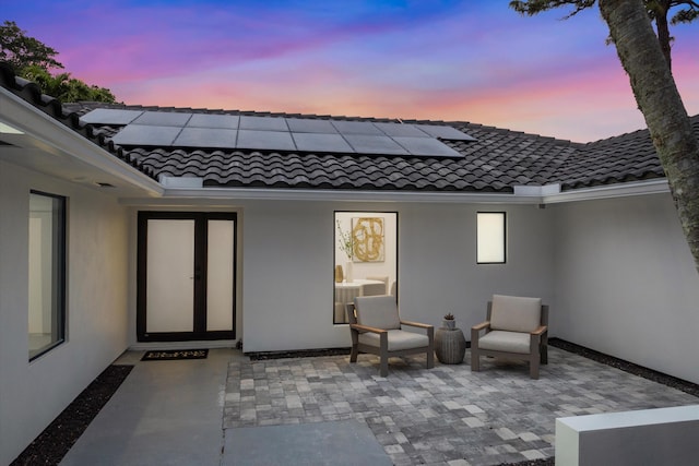 view of patio terrace at dusk