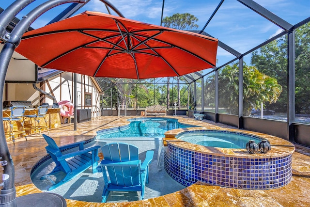 view of pool featuring a patio area, an in ground hot tub, and exterior bar