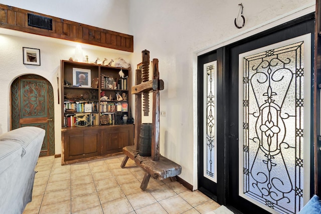 foyer entrance featuring light tile patterned floors