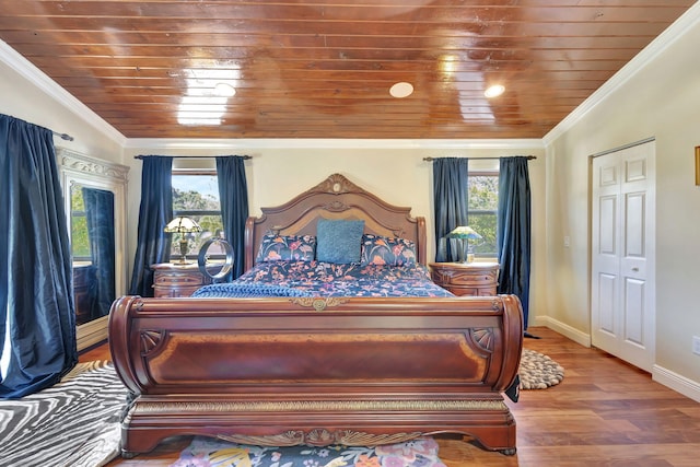 bedroom with hardwood / wood-style flooring, wood ceiling, crown molding, and vaulted ceiling