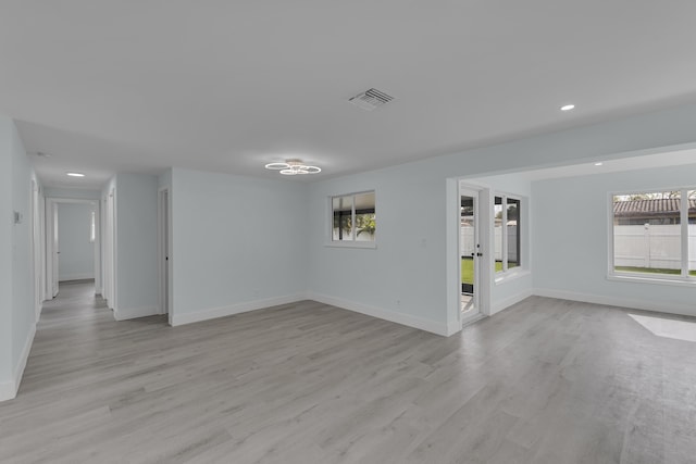 spare room with light hardwood / wood-style floors