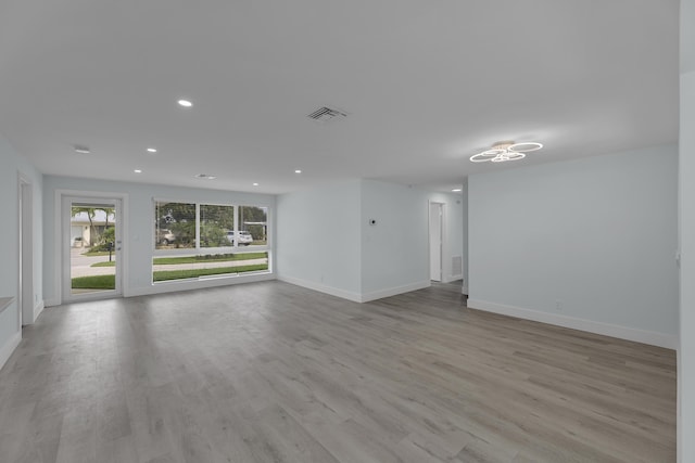 unfurnished living room featuring light hardwood / wood-style flooring