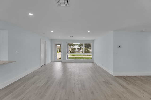 unfurnished living room with light wood-type flooring