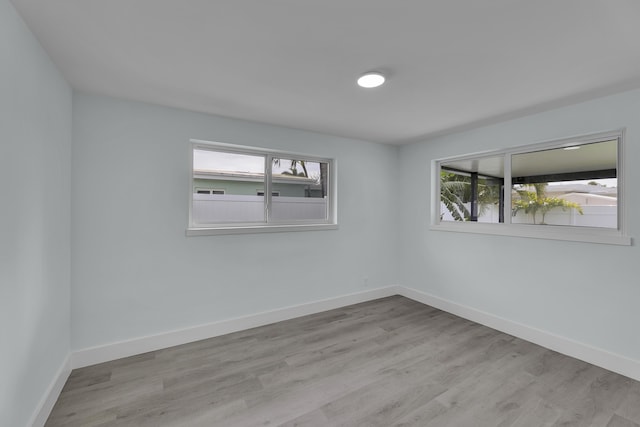 unfurnished room featuring light hardwood / wood-style floors