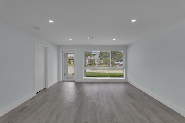 spare room featuring light hardwood / wood-style floors