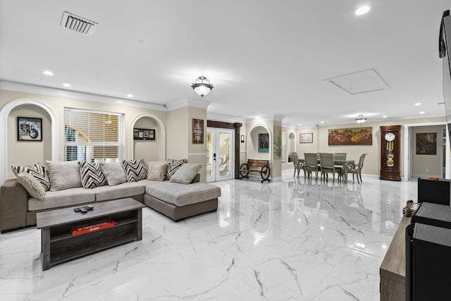 living room featuring ornamental molding and french doors