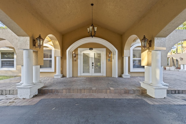 view of exterior entry featuring french doors