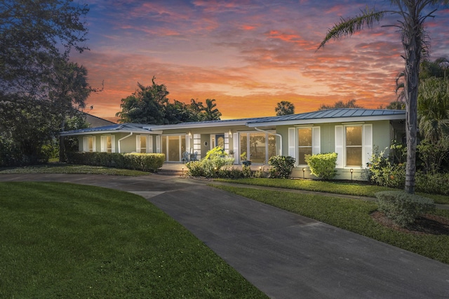 view of front of property with a yard