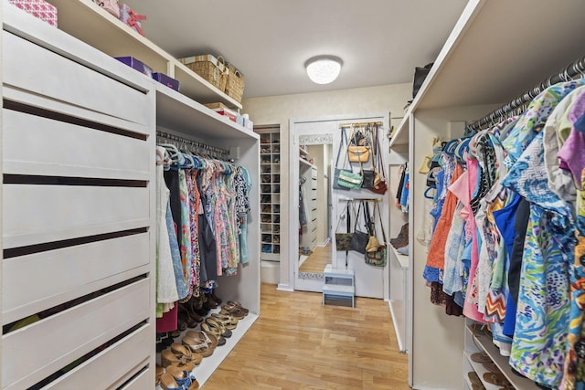 walk in closet featuring light hardwood / wood-style floors