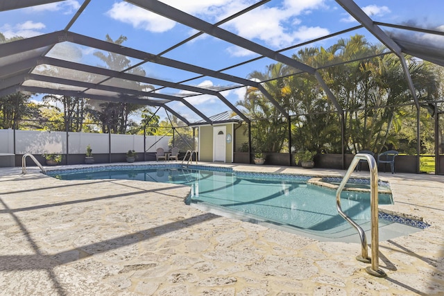 view of swimming pool featuring a patio area and glass enclosure