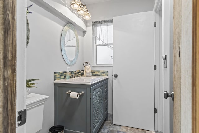 bathroom with backsplash and vanity