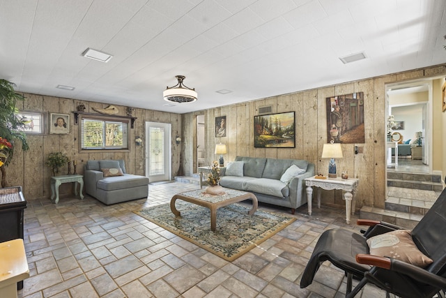 living room featuring wooden walls