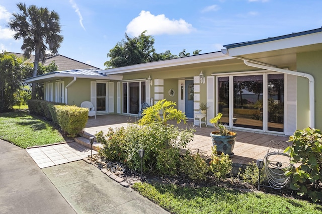 rear view of house with a patio area