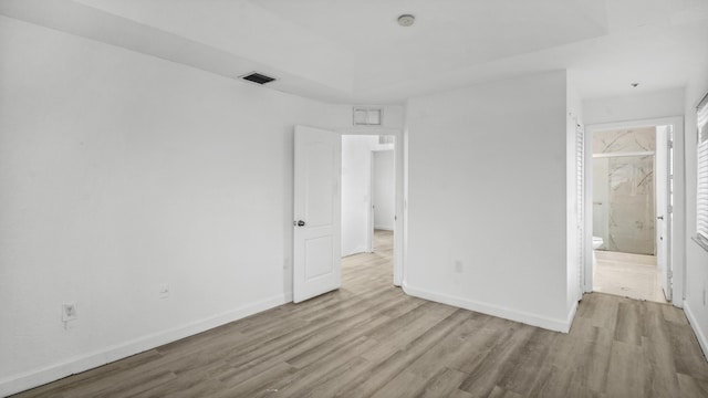 empty room with light hardwood / wood-style floors