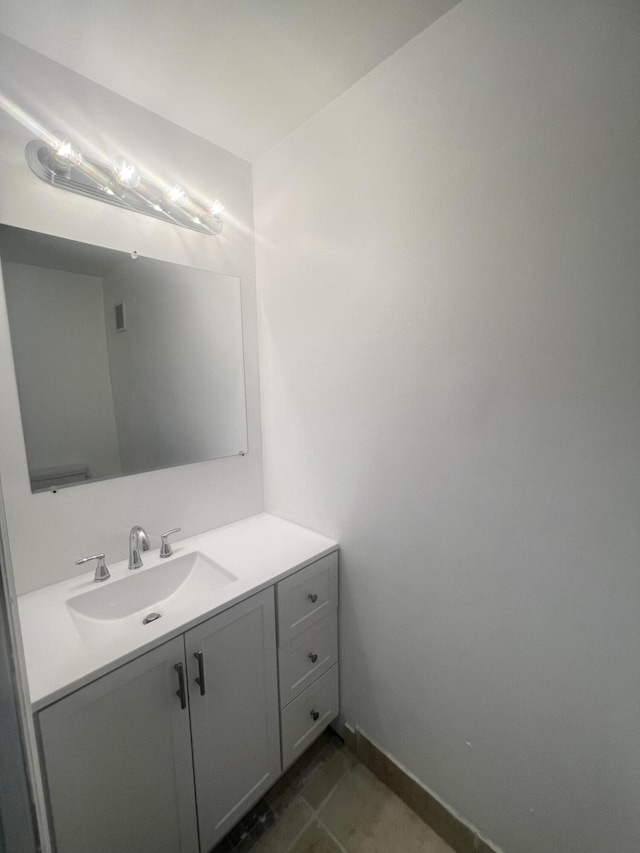 bathroom with vanity and tile patterned flooring