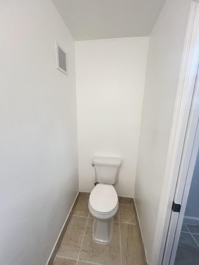 bathroom featuring toilet