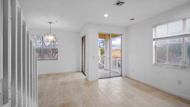 spare room with a wealth of natural light