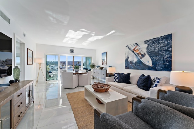 living room with light tile patterned floors