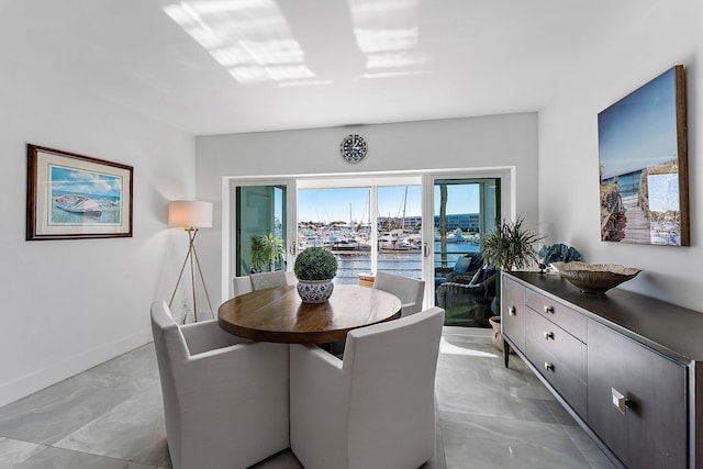 dining area featuring a water view