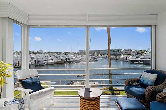 sunroom / solarium with a water view